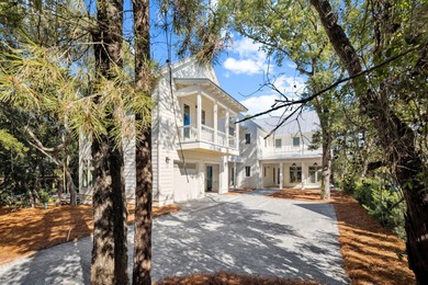 NOTHING SHORT OF SENSATIONAL! This opulent Seagrove Beach custom