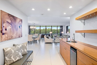 This sophisticated 2,600+ SF residence at Sloan's Curve offers