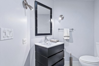 This sophisticated 2,600+ SF residence at Sloan's Curve offers