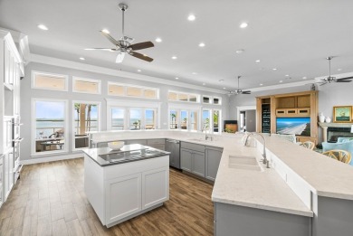 This extraordinary waterfront estate spans over 4,300 sq. ft. of