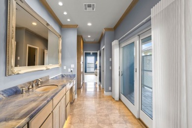 This extraordinary waterfront estate spans over 4,300 sq. ft. of