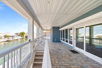 This extraordinary waterfront estate spans over 4,300 sq. ft. of