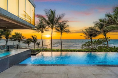 This exquisite custom-built oceanfront estate is a true