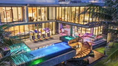 This exquisite custom-built oceanfront estate is a true
