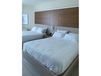 Welcome to Unit 1215 at The Q Club, a luxury condo-hotel