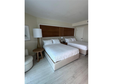 Welcome to Unit 1215 at The Q Club, a luxury condo-hotel