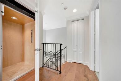 Experience the epitome of urban luxury in this 3-level townhome