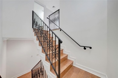 Experience the epitome of urban luxury in this 3-level townhome