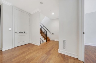 Experience the epitome of urban luxury in this 3-level townhome
