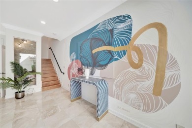 Experience the epitome of urban luxury in this 3-level townhome