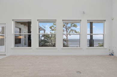 Live the dream in this spectacular Bay front oasis thoughtfully