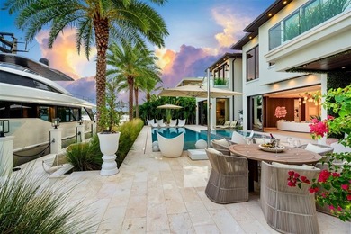 TIMELESS WATERFRONT MASTERPIECE IN EXCLUSIVE HARBOR BEACH! A