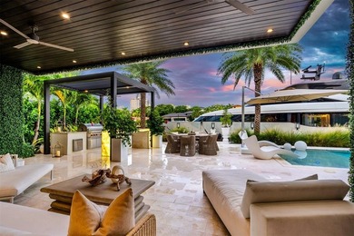 TIMELESS WATERFRONT MASTERPIECE IN EXCLUSIVE HARBOR BEACH! A