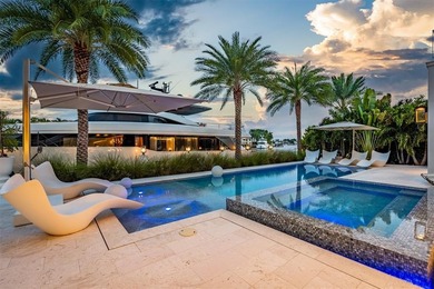 TIMELESS WATERFRONT MASTERPIECE IN EXCLUSIVE HARBOR BEACH! A