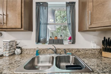 Tucked away on a VERY INTIMATE and ISOLATED.55-acre corner lot