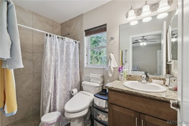 Tucked away on a VERY INTIMATE and ISOLATED.55-acre corner lot