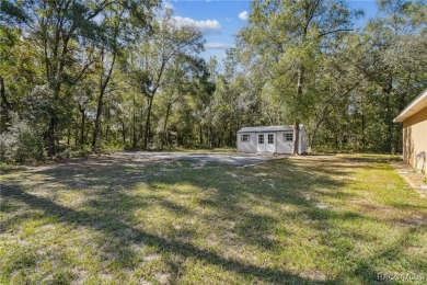 Tucked away on a VERY INTIMATE and ISOLATED.55-acre corner lot
