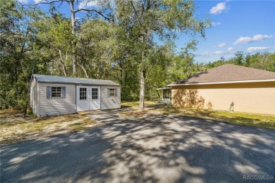 Tucked away on a VERY INTIMATE and ISOLATED.55-acre corner lot
