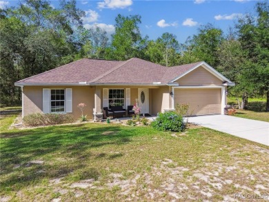 Tucked away on a VERY INTIMATE and ISOLATED.55-acre corner lot