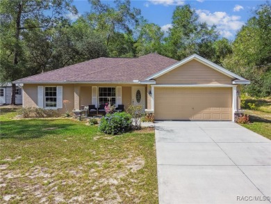 Tucked away on a VERY INTIMATE and ISOLATED.55-acre corner lot