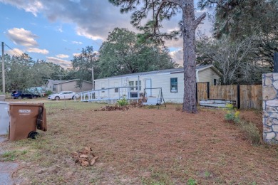 Charming 3 bed / 2 bath manufactured home on .25-acre lot. The