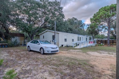 Charming 3 bed / 2 bath manufactured home on .25-acre lot. The