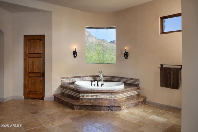 This magnificent home rest on nearly 2 extremely private acres