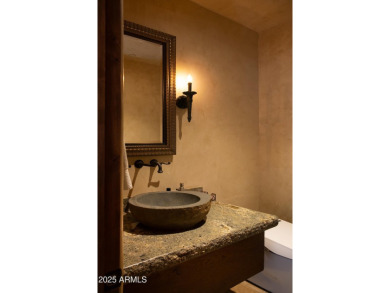 This magnificent home rest on nearly 2 extremely private acres