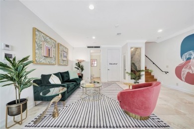 Experience the epitome of urban luxury in this 3-level townhome