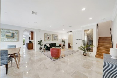 Experience the epitome of urban luxury in this 3-level townhome