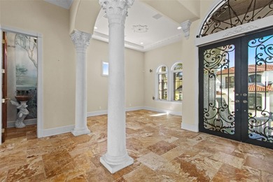 Experience this sleek, modernized Mediterranean masterpiece in