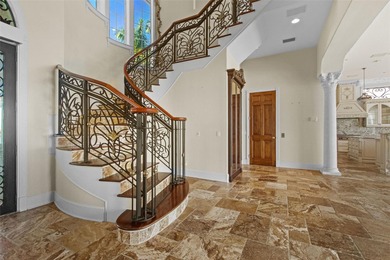 Experience this sleek, modernized Mediterranean masterpiece in