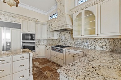 Experience this sleek, modernized Mediterranean masterpiece in