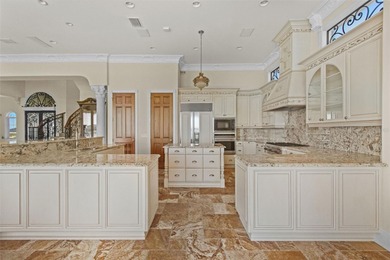 Experience this sleek, modernized Mediterranean masterpiece in