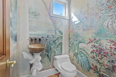 Experience this sleek, modernized Mediterranean masterpiece in