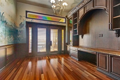 Experience this sleek, modernized Mediterranean masterpiece in