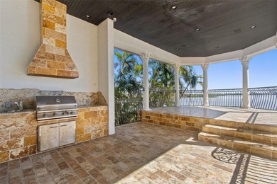 Experience this sleek, modernized Mediterranean masterpiece in