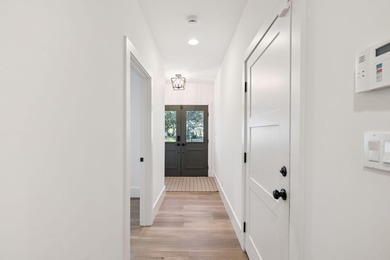 Completed in 2024, this stunning harborfront home offers the