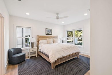 Completed in 2024, this stunning harborfront home offers the