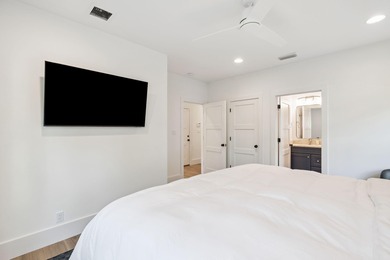 Completed in 2024, this stunning harborfront home offers the