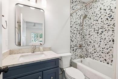 Completed in 2024, this stunning harborfront home offers the