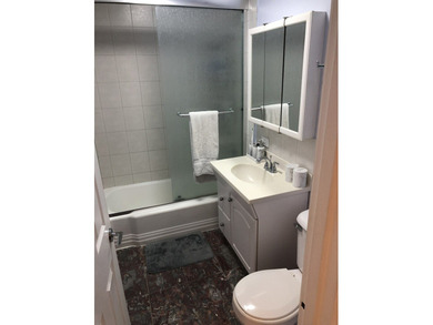 Sunlit top-floor living featuring 2 bedrooms, 1 full bath, and