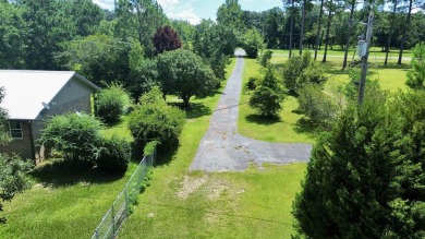 This Monticello gem truly has it all! Situated on 1.8