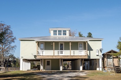 Waterfront custom home with private beach access on a quiet