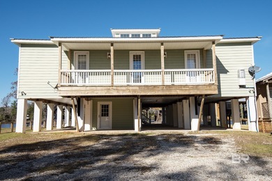Waterfront custom home with private beach access on a quiet
