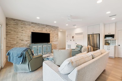 Completed in 2024, this stunning harborfront home offers the