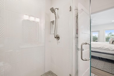 Completed in 2024, this stunning harborfront home offers the