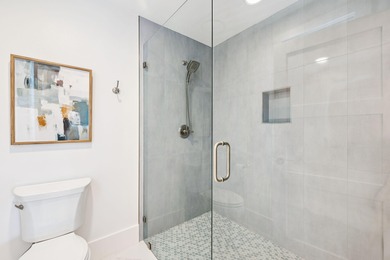 Completed in 2024, this stunning harborfront home offers the