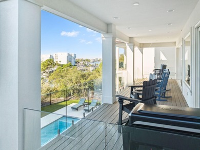 Completed in 2024, this stunning harborfront home offers the