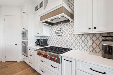 Completed in 2024, this stunning harborfront home offers the